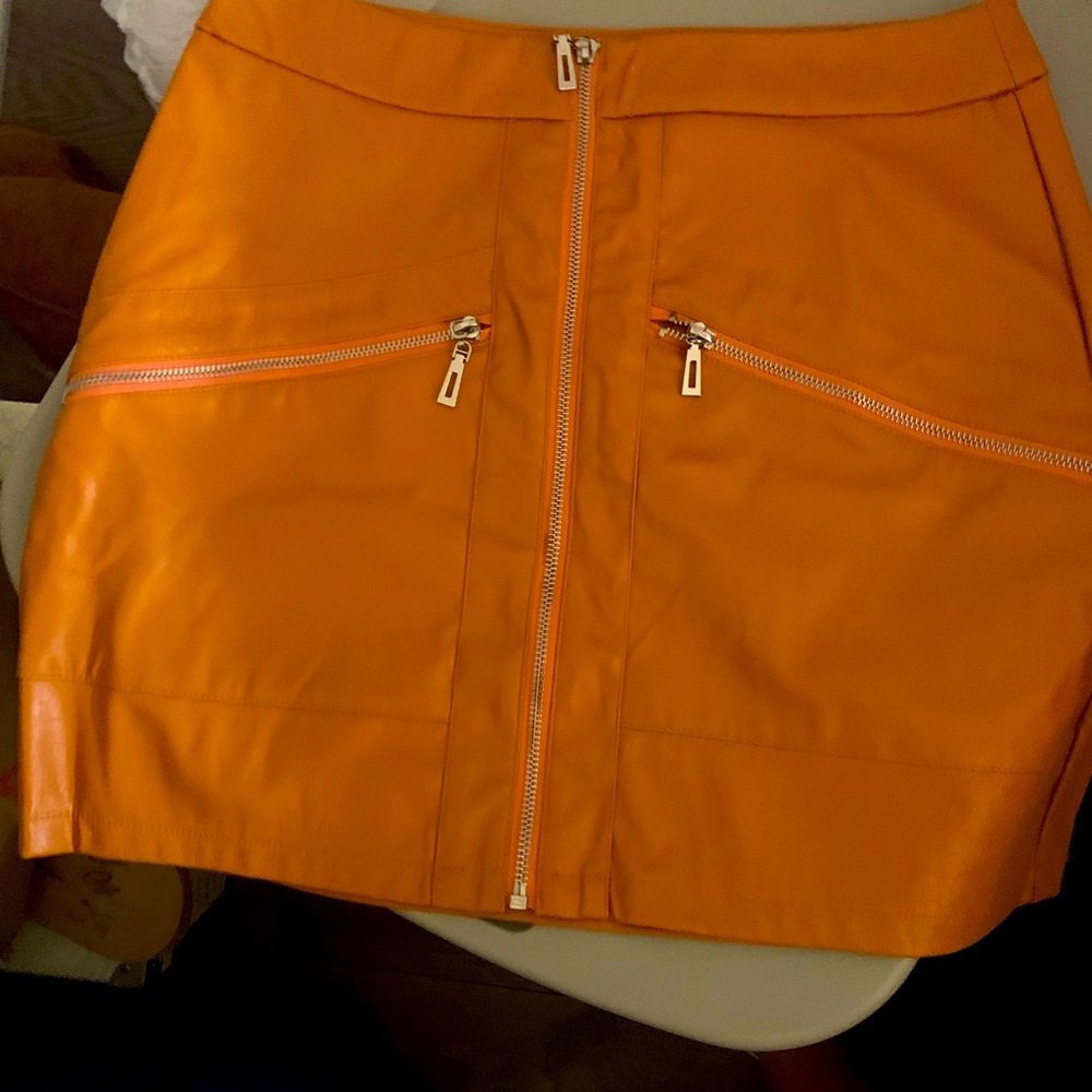Faux leather orange mini skirt
